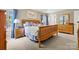 Comfortable bedroom with wooden furniture set and large windows with natural light at 9101 Strattonville Ct, Huntersville, NC 28078