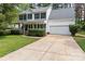 Charming two-story home with a well-manicured lawn, a two car garage and a welcoming front porch at 9101 Strattonville Ct, Huntersville, NC 28078