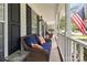 Inviting covered front porch with cozy seating, perfect for relaxing and enjoying the outdoors at 9101 Strattonville Ct, Huntersville, NC 28078