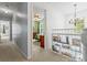 Hallway view with neutral carpet and white trim, offering access to various rooms of the house at 9101 Strattonville Ct, Huntersville, NC 28078
