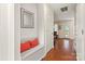 Entryway featuring hardwood floors, a built-in bench with pillows, and access to other rooms at 9101 Strattonville Ct, Huntersville, NC 28078