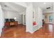 Bright and airy living room with hardwood floors, a built-in bench, and views of other rooms at 9101 Strattonville Ct, Huntersville, NC 28078
