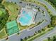 Aerial view of community pool, tennis courts, clubhouse, and parking area at 10201 Daufuskie Dr, Charlotte, NC 28278