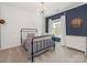 Inviting bedroom with shiplap accent wall, gingham bedding, and natural light at 10201 Daufuskie Dr, Charlotte, NC 28278