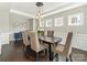 Cozy dining room featuring a live edge wood table, upholstered chairs, and stylish decor at 10201 Daufuskie Dr, Charlotte, NC 28278