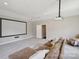 Media room with a projector screen and a comfortable sectional couch at 10201 Daufuskie Dr, Charlotte, NC 28278
