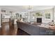 Spacious layout combining the living room with fireplace, open kitchen, and dining area at 10201 Daufuskie Dr, Charlotte, NC 28278