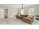 Spacious living room with a projector and a comfortable sectional couch at 10201 Daufuskie Dr, Charlotte, NC 28278