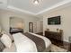 Spacious main bedroom featuring hardwood floors, trey ceilings, and comfortable seating at 10201 Daufuskie Dr, Charlotte, NC 28278