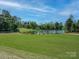 Picturesque view of the golf course and a beautiful pond in a lush green landscape at 10201 Daufuskie Dr, Charlotte, NC 28278