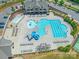 A gorgeous aerial view of the neighborhood pool featuring a slide, a snack bar, and plenty of seating at 10201 Daufuskie Dr, Charlotte, NC 28278