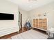 Spacious room featuring hardwood floors, storage unit and a fun decorative tent at 10201 Daufuskie Dr, Charlotte, NC 28278