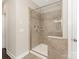 Modern bathroom with a glass enclosed shower featuring tile surround and multiple shower heads at 10201 Daufuskie Dr, Charlotte, NC 28278