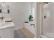 Bright bathroom featuring a shower, bathtub, and a vanity with a well-lit mirror at 10508 Madison Park Dr, Charlotte, NC 28269