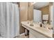Bathroom features a white vanity and shower with a decorative curtain, offering a clean design at 10508 Madison Park Dr, Charlotte, NC 28269