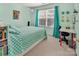 Bright bedroom with blue decor, featuring a desk area and a large window at 10508 Madison Park Dr, Charlotte, NC 28269