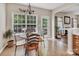 Inviting breakfast nook with natural light, a table and chairs and view of the deck at 10508 Madison Park Dr, Charlotte, NC 28269