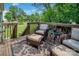 Outdoor deck with furniture and view of lush backyard at 10508 Madison Park Dr, Charlotte, NC 28269