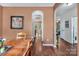 Dining room with wood floors, arched openings and seamless flow to other living areas at 10508 Madison Park Dr, Charlotte, NC 28269