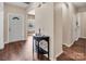 Welcoming entryway featuring wood floors, neutral walls, and a view into adjacent rooms at 10508 Madison Park Dr, Charlotte, NC 28269