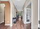 Inviting entry hall with dark wood floors and arched doorways leading to living spaces at 10508 Madison Park Dr, Charlotte, NC 28269