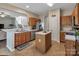 Well-lit kitchen with stainless steel appliances, tiled floor, and central island at 10508 Madison Park Dr, Charlotte, NC 28269