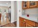 Open-concept kitchen showcasing stainless steel appliances and warm-toned wooden cabinetry at 10508 Madison Park Dr, Charlotte, NC 28269