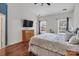 Bright bedroom features high ceilings, wood floors, and two large windows at 10508 Madison Park Dr, Charlotte, NC 28269