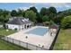 Community swimming pool is fully enclosed with a cabana at 10508 Madison Park Dr, Charlotte, NC 28269