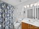 Well-lit bathroom features a vanity sink, a toilet, and a shower-tub combo, providing a functional and comfortable space at 1151 Gower St, Fort Mill, SC 29708