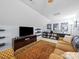 Cozy bonus room with a large television, comfortable seating, and decorative shelving offers an ideal entertainment space at 1151 Gower St, Fort Mill, SC 29708