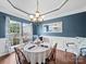 Elegant dining room with wainscoting, chandelier, and a round table perfect for Gathering meals at 1151 Gower St, Fort Mill, SC 29708