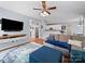 Cozy living room featuring hardwood floors, a ceiling fan, and open access to the modern kitchen at 1151 Gower St, Fort Mill, SC 29708