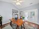 Bright sunroom with a desk, hardwood floors, and views through French doors to the spacious yard at 1151 Gower St, Fort Mill, SC 29708