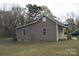 Single-story home featuring light siding, with a gable roof, and limited landscaping at 120 Mccleave Rd, China Grove, NC 28023