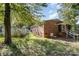 Backyard view of a red brick home with a porch, patio and above-ground pool at 1239 Christopher Cir, Rock Hill, SC 29730
