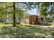 Backyard view of a red brick home with a porch, patio and above-ground pool at 1239 Christopher Cir, Rock Hill, SC 29730