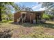 Backyard view of a red brick home with a porch and patio at 1239 Christopher Cir, Rock Hill, SC 29730