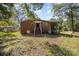 Backyard view of a red brick home with a porch, patio and above-ground pool at 1239 Christopher Cir, Rock Hill, SC 29730