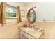 Cozy bathroom with a sink, granite countertops, and oval mirror at 1239 Christopher Cir, Rock Hill, SC 29730