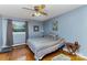 Cozy bedroom with hardwood floors, a ceiling fan, and a colorful quilt on the bed at 1239 Christopher Cir, Rock Hill, SC 29730