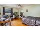Bedroom featuring hardwood floors, ceiling fan, large window, and shelving at 1239 Christopher Cir, Rock Hill, SC 29730