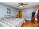 Cozy bedroom with hardwood floors, a ceiling fan, TV and decorative wall art at 1239 Christopher Cir, Rock Hill, SC 29730