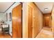 Hallway showing a mix of wood paneling and paint leading to a bedroom with hardwood floors at 1239 Christopher Cir, Rock Hill, SC 29730