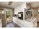 Bright kitchen with granite counters, stainless steel appliances and a tiled backsplash by the oven at 1239 Christopher Cir, Rock Hill, SC 29730