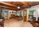 Cozy living room with wood ceiling, brick fireplace, and ample natural light at 1239 Christopher Cir, Rock Hill, SC 29730