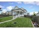 Grassy backyard featuring a cozy patio under a covered porch and privacy fence at 13624 Jacks Ln, Pineville, NC 28134