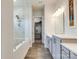 Bathroom showcasing walk-in shower, dual vanity, and walk-in closet at 13624 Jacks Ln, Pineville, NC 28134