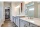 Bathroom with dual vanities, walk-in shower, and walk-in closet at 13624 Jacks Ln, Pineville, NC 28134