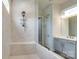 Bathroom featuring a luxurious walk-in shower with tiled walls and modern fixtures at 13624 Jacks Ln, Pineville, NC 28134